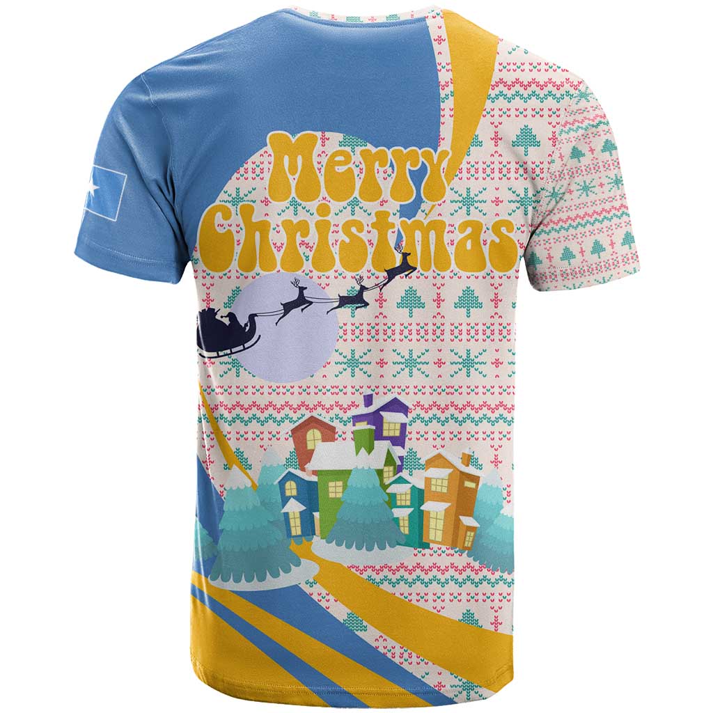 Somalia Christmas T-Shirt with Santa Cheetah Christmas Tree Village Scene and Festive Snowflake Graphic Tee