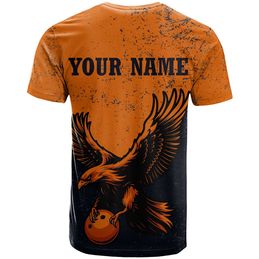 Flying Eagle Carrying Bowling Ball T-Shirt with Grunge Orange and Black Splatter Design Graphic Tee