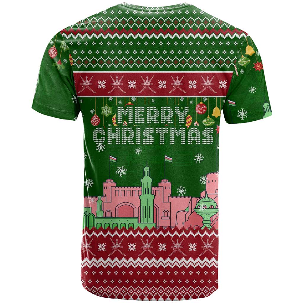 Oman Christmas T-Shirt with Green-Red Pattern, Mosque and Fort Landmarks, and Festive Ornament Motif Graphic Tee