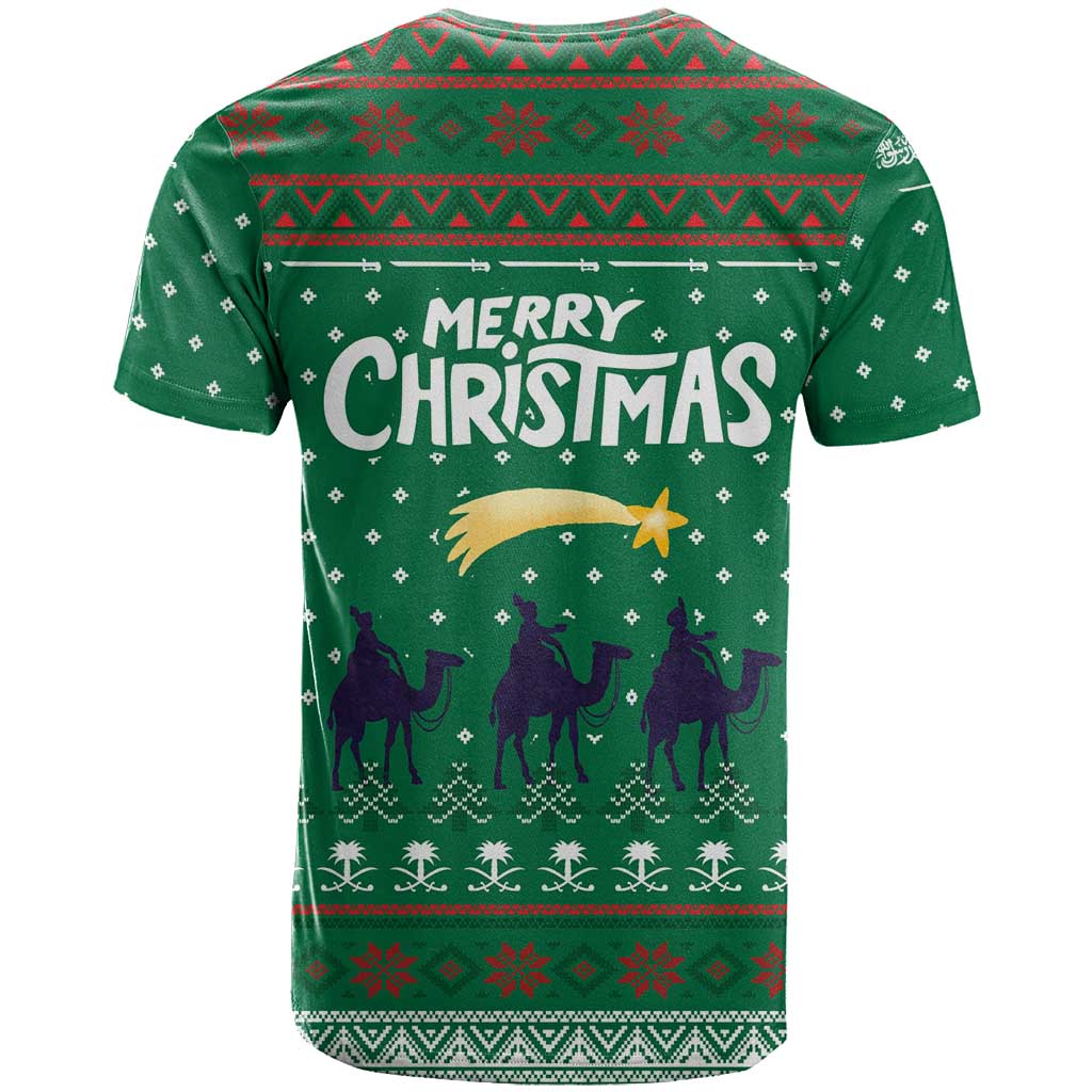 Saudi Arabia Christmas T-Shirt with Green Pattern, Traditional Script Motif, and Camel Caravan Silhouette Graphic Tee