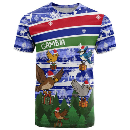 Gambia Christmas T-Shirt with Santa Birds Gift Boxes Forest Scene and Snowflake Pattern Design Graphic Tee