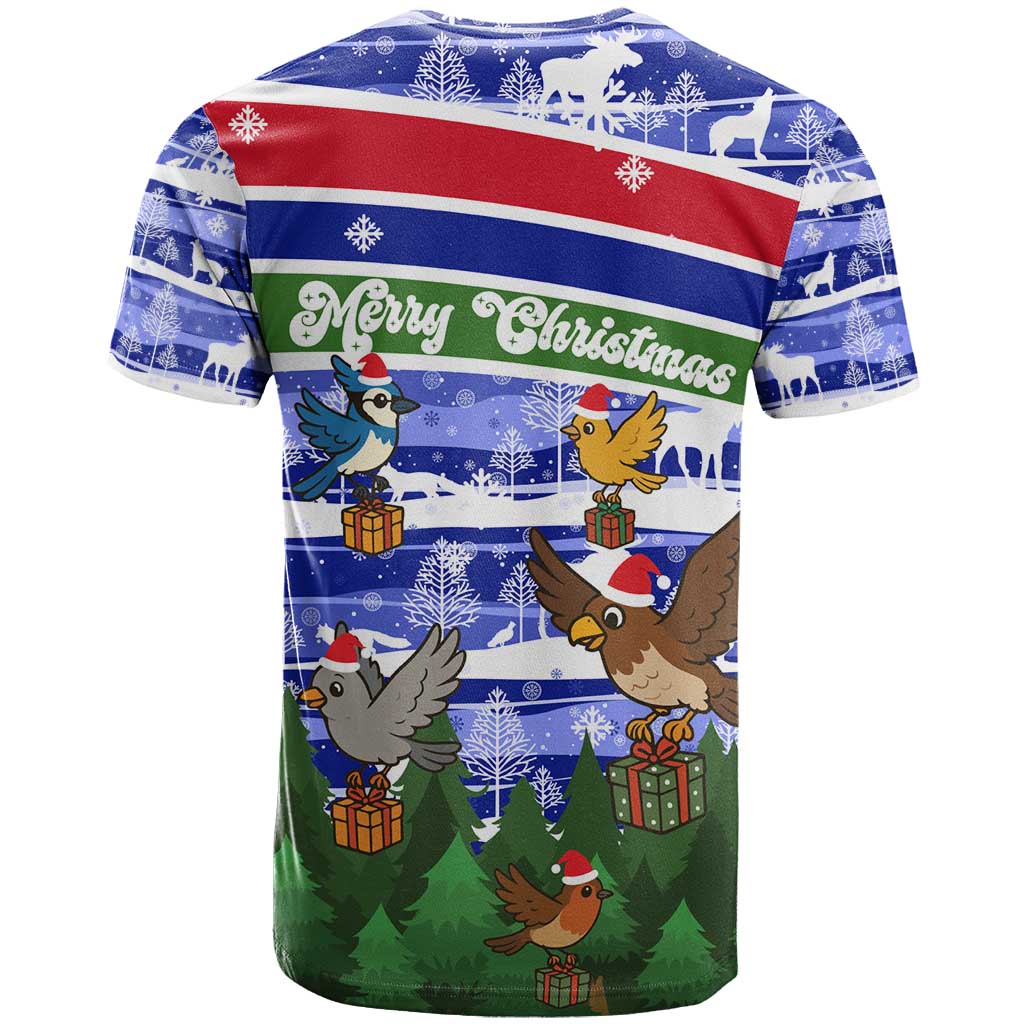 Gambia Christmas T-Shirt with Santa Birds Gift Boxes Forest Scene and Snowflake Pattern Design Graphic Tee